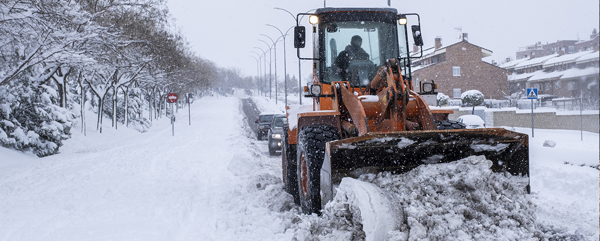 Machine Plowing Snow on Road