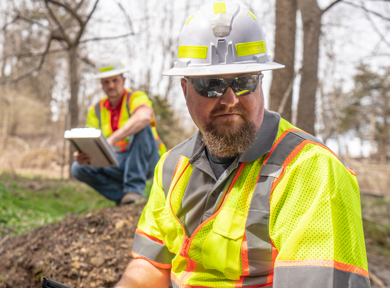 PILLAR Workers Inspecting Drain Box