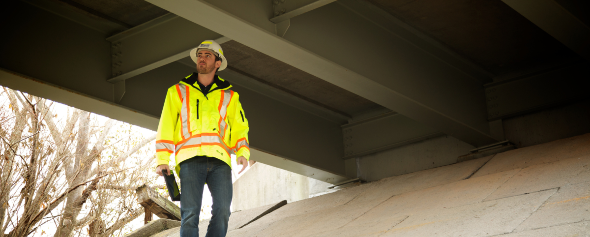 man inspecting bridge