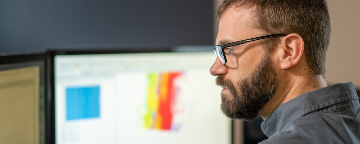 man looking at computer screen